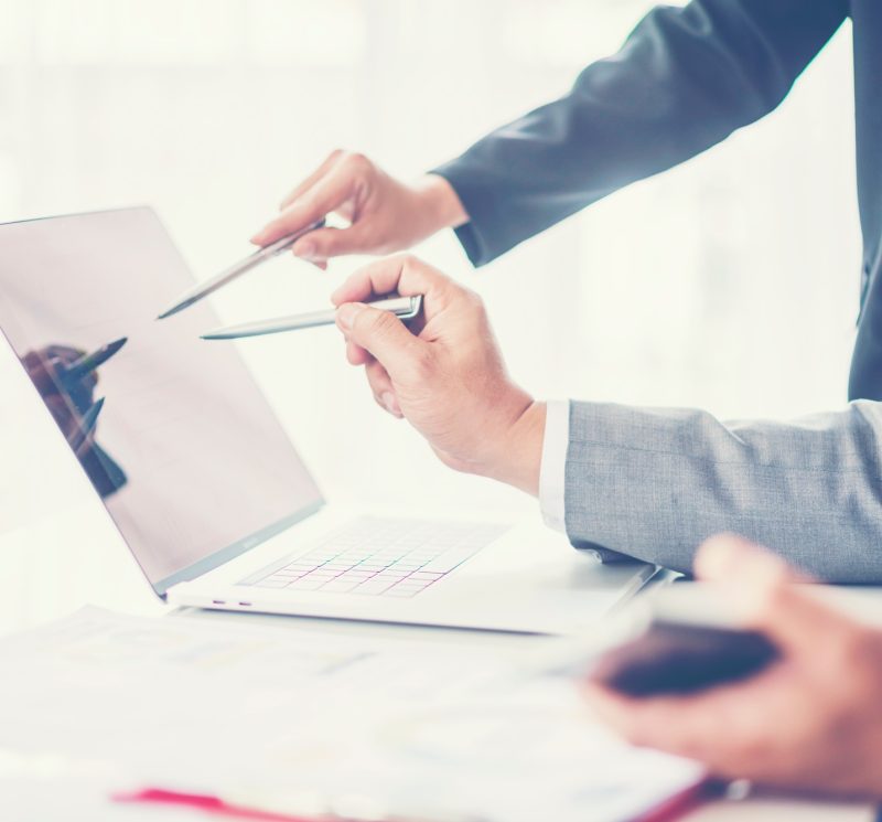 Business adviser analyzing financial figures denoting the progress in the work of the company